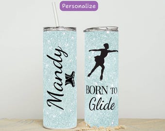 May include: A light blue glitter tumbler with a straw. One side features the name "Mandy" with a figure skating boot graphic. The other side has a black silhouette of a skater and the words "Born to Glide".