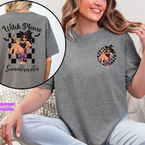 May include: Graphite heather t-shirt featuring a witch graphic in a martini glass, with the text "Witch Please, it's Summerween" on the back. The front has a smaller version of the graphic. The shirt has a relaxed fit.