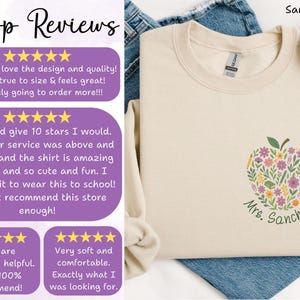 May include: Sand-colored sweatshirt with an apple design filled with flowers and greenery. The text "Mrs. Sanchez" is below the apple. The image also shows customer reviews.