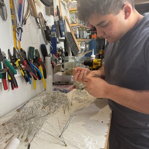 Handcrafting the crystal pieces and putting them into the spike to make it look like a SPUTNIK spike!