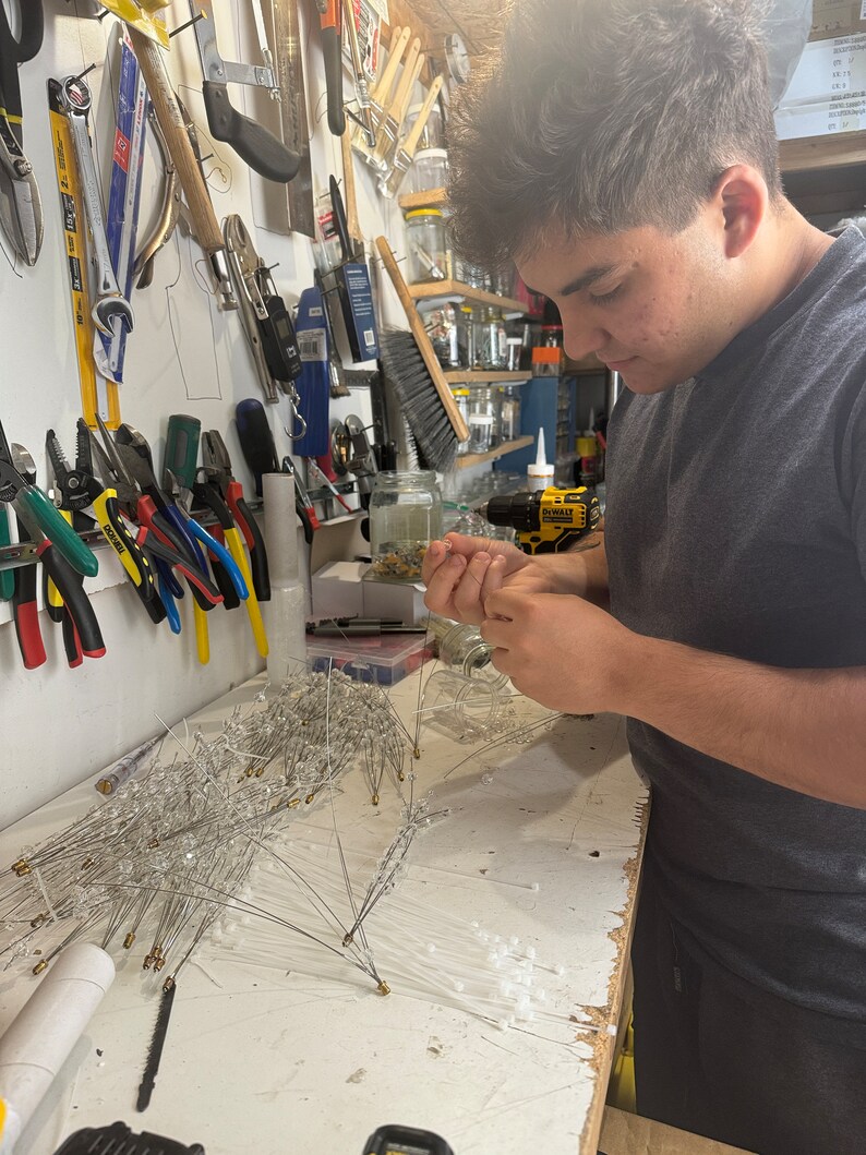 Handcrafting the crystal pieces and putting them into the spike to make it look like a SPUTNIK spike!