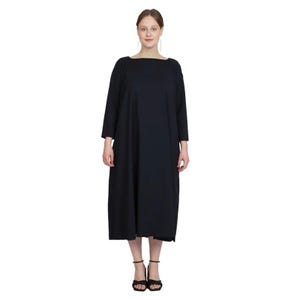 May include: A black long-sleeved dress with a square neckline and a flowing silhouette.