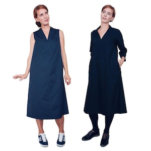 May include: Two women wearing sleeveless and long-sleeved navy blue dresses with a V-neckline. The dresses have a loose fit and fall to the knee. One woman is wearing white sneakers and the other is wearing black shoes.