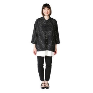 May include: A black and white striped long-sleeved shirt with a collared neckline and button closure. The shirt is loose-fitting and has a relaxed silhouette.
