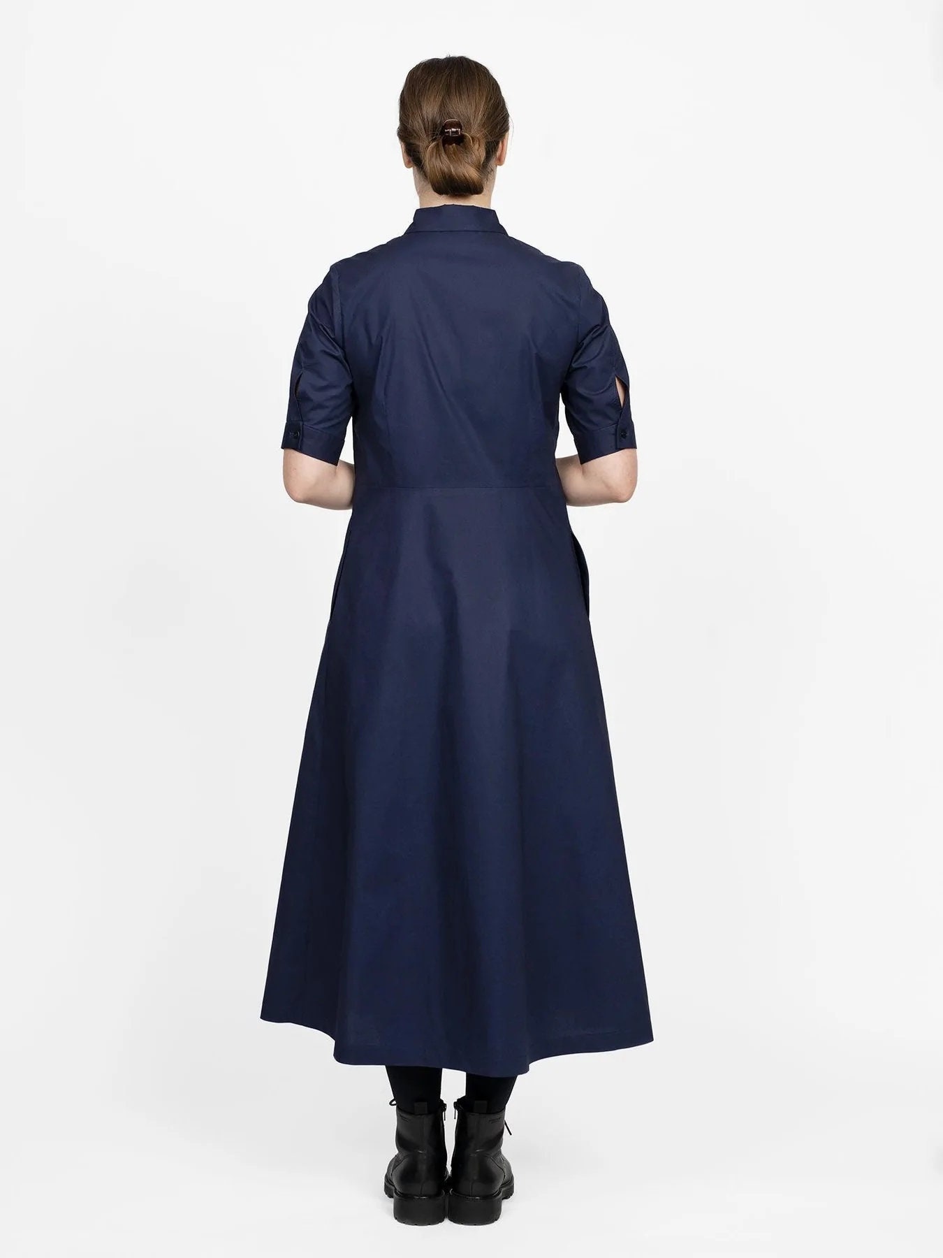 the assembly line shirt dress Our Shirt dress features a slight A-line silhouette and is designed to end  at mid-calf length. Comes with a regular collar, a front button placket and  two different cuff sleeves to choose