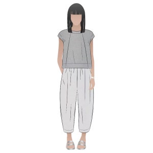 May include: A woman is wearing a gray short-sleeved top and white pants. She is wearing silver sandals.