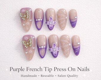 Ongles violets Ferena à enfoncer avec pointe française, papillon et fleur 3D | Ongles nude amande | Ongles réutilisables faits main