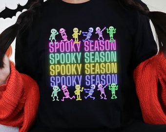 Neon Dancing Skeletons Spooky Season Black Halloween Sweatshirt, Unisex Black Sweatshirt, Cold Weather Halloween Sweatshirt