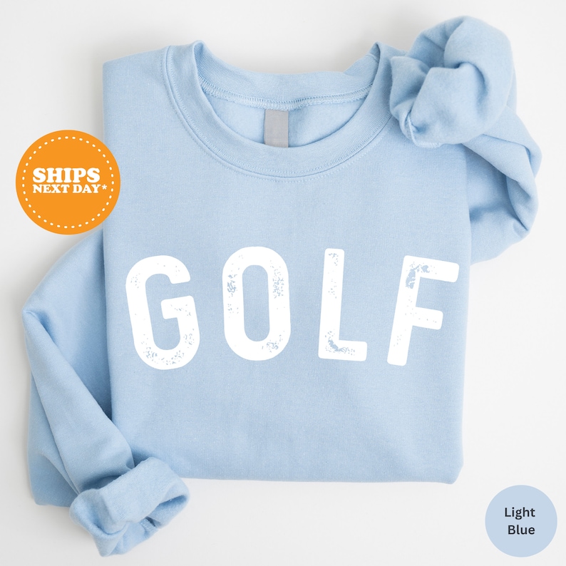 a blue shirt with the word golf printed on it