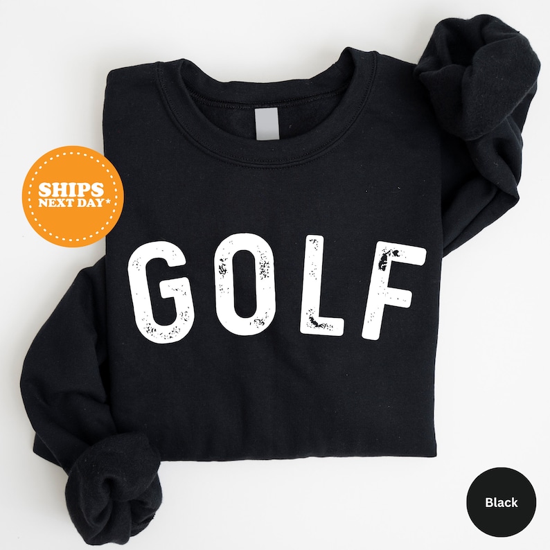 a black shirt with the word golf printed on it