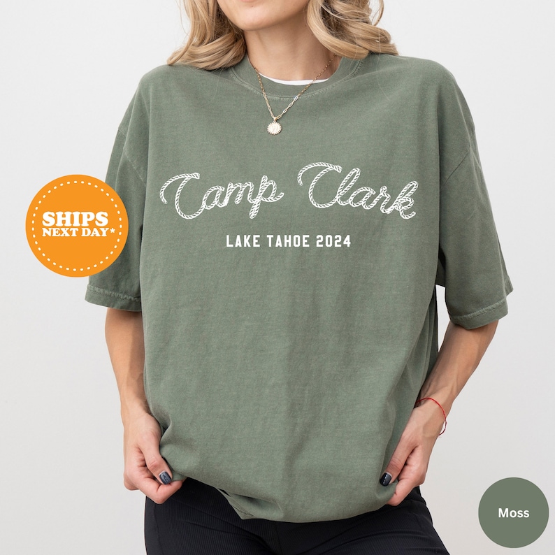 a woman wearing a green camp clark shirt