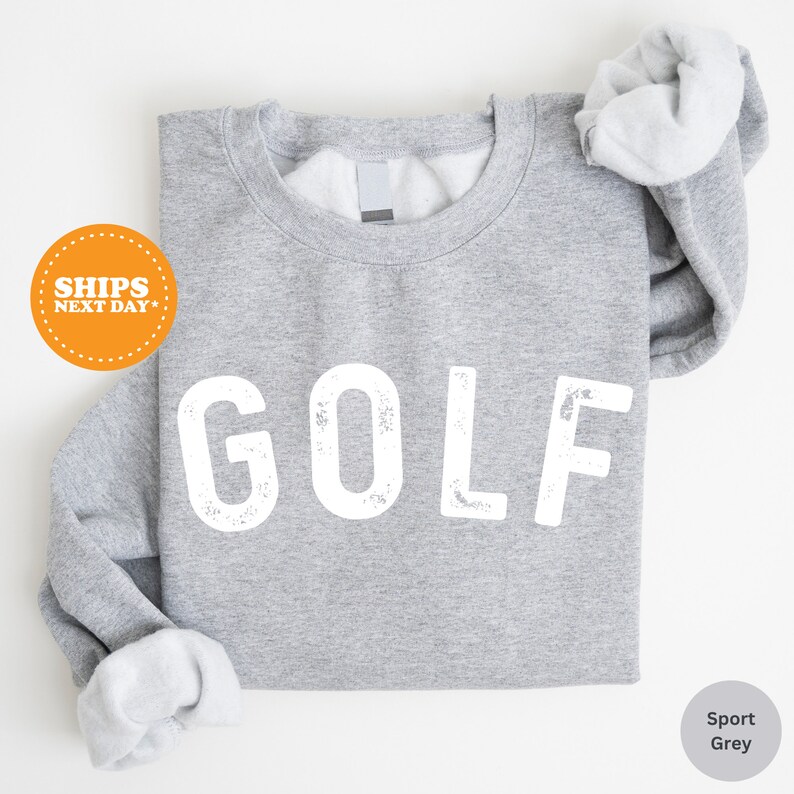 a gray shirt with the word golf printed on it