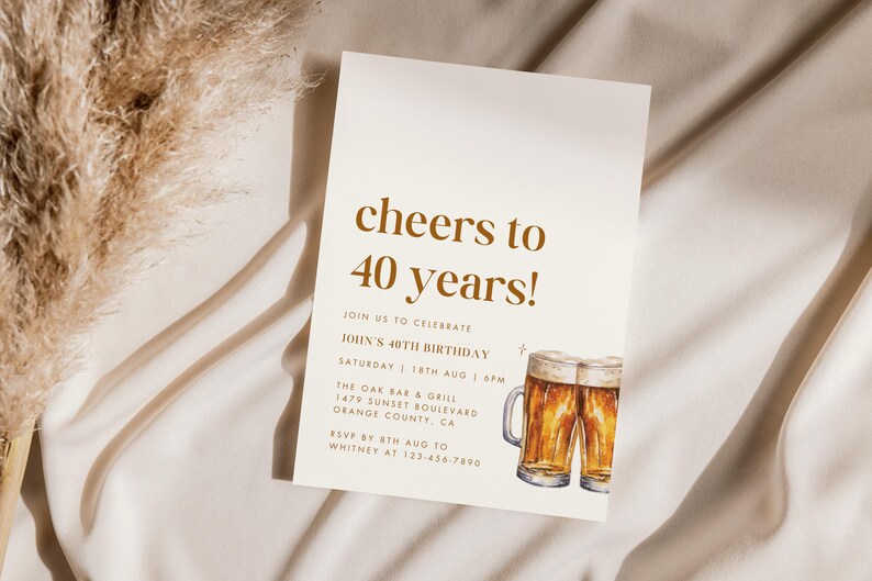 May include: A cream-colored invitation with the text "cheers to 40 years!" in brown. The invitation includes details for a 40th birthday celebration, featuring watercolor illustrations of two beer mugs. The background is a neutral beige.