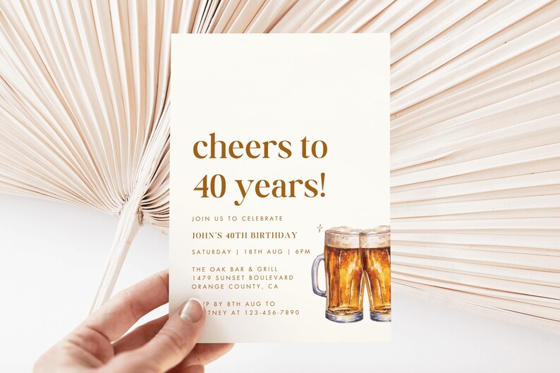 May include: A cream-colored invitation card with the text "cheers to 40 years!" in brown. The card also includes details for a birthday celebration and a watercolor illustration of two beer mugs.