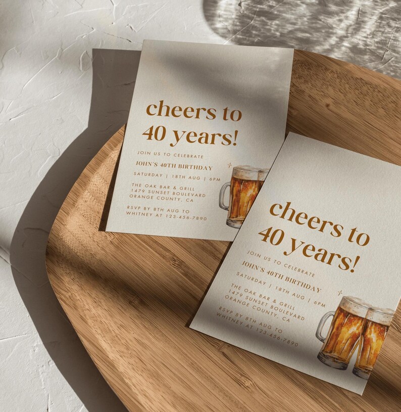 May include: Two invitation cards with the text "cheers to 40 years!" in brown. The cards include details for John's 40th birthday, a watercolor illustration of beer mugs, and event information.