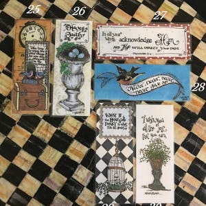 May include: Ten colorful bookmarks with inspirational quotes and illustrations. The bookmarks feature a variety of designs, including birds, flowers, and a birdcage. The quotes include "Have Faith", "In all your ways acknowledge Him", "Never, never, never give up", "What if the honey pot is what he is all about", and "I wish you all the joy that you can".