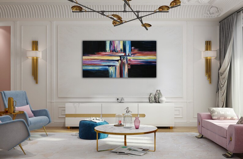 May include: Abstract painting with colorful stripes and lines on a black background. The painting is hanging on a white wall in a living room setting.