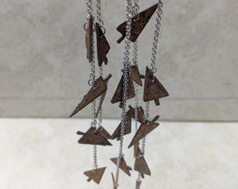 Dónde está el país de las maravillas - Flechas en tantas direcciones Carillón de viento