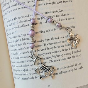 Handcrafted Beaded Bookmark featuring Unicorn Skeleton Charm - Quirky Literary Accessory