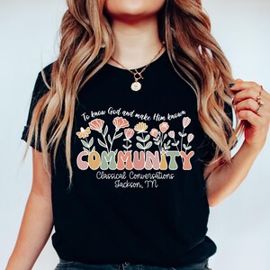 May include: Black t-shirt with a floral design and the text "To know God and make Him known COMMUNITY Classical Conversations Jackson, TN".