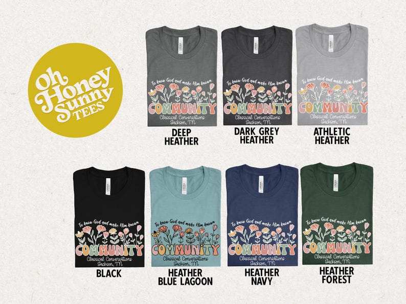 May include: A mockup of a t-shirt design featuring a floral graphic with the text "To know God and make Him known, COMMUNITY, Classical Conversations, Jackson, TN". The design is shown on different colored t-shirts, including deep heather, dark grey heather, athletic heather, black, heather blue lagoon, heather navy, and heather forest.