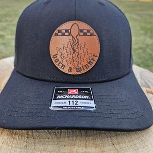 Born A Winner! Full Grain Leather Patch Richardson112 Snap-Back Trucker Hat