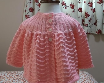 Pull bébé rose bonbon en tricot à la main manteau de la matinée