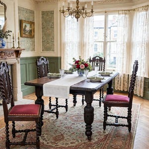 May include: A dark wood dining table with barley twist legs and four matching chairs featuring red upholstered seats. The table is set with a white runner, floral centerpiece, and place settings, positioned in a room with green wainscoting.