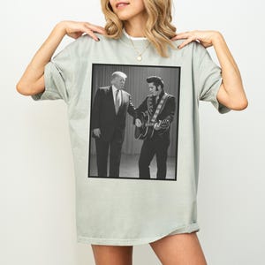 May include: A handmade wooden sign with the text "Welcome" in a playful font. The sign features a distressed white background and a dark stained wooden frame. A small, decorative heart is attached to the sign.