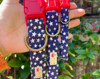 May include: Three blue and white dog collars with red buckles and gold hardware. The collars feature a white star pattern on a blue background. The collars are labeled "Very" in white text on a red background.