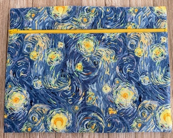 May include: A quilted fabric case featuring a print inspired by Van Gogh's "Starry Night." The design showcases swirling blue, yellow, and white brushstrokes. A yellow zipper runs across the top. The case is rectangular.