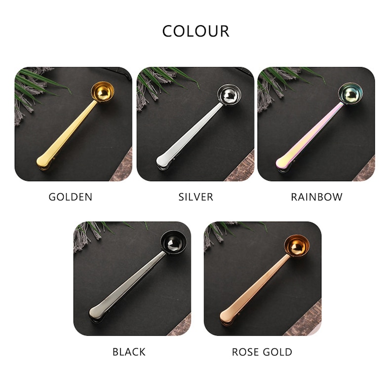 May include: Five different colored coffee scoop clips. The scoops are gold, silver, rainbow, black, and rose gold. The scoops are all the same size and shape. They are made of metal and have a clip on the end to hold them to the side of a coffee bag.