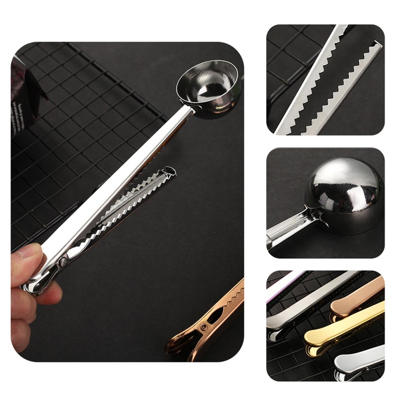 May include: A silver measuring spoon with a clip attached to the handle. The spoon has a serrated edge and is used for measuring coffee grounds. The clip can be used to attach the spoon to a coffee bag.