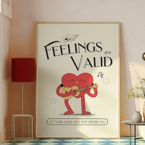 K&ouml;nnte beinhalten: Ein beiger Poster mit dem Text "All Feelings are Valid" in schwarzer Kursivschrift. Eine rote herzf&ouml;rmige Figur mit Beinen und Armen spielt Gitarre. Der Text "Let them guide you, not define you" befindet sich unter der Figur.