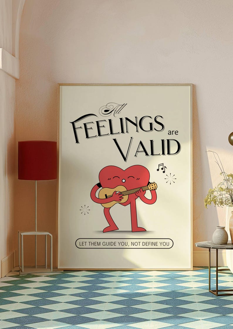 K&ouml;nnte beinhalten: Ein beiger Poster mit dem Text "All Feelings are Valid" in schwarzer Kursivschrift. Eine rote herzf&ouml;rmige Figur mit Beinen und Armen spielt Gitarre. Der Text "Let them guide you, not define you" befindet sich unter der Figur.