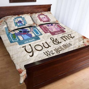 May include: A personalized quilt set featuring a cartoon character design. The quilt and pillowcases display the text "You & Me We got this" and include spaces for names. The design incorporates blue, pink, and brown tones, with a wood-like background.