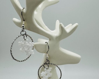 Flurry Earrings - Seed bead Snowflakes in silver toned hoops