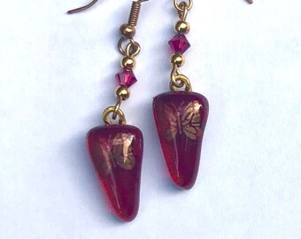 Cranberry triangle dichroic glass earrings with gold butterfly decals and Swarovski beads