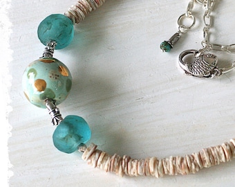 Beautiful rustic clam shell and aqua African recycled glass