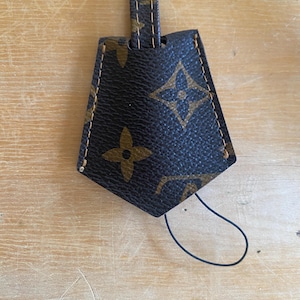 Louis Vuitton Key Bell Leather Strap in LV Logo Clochette