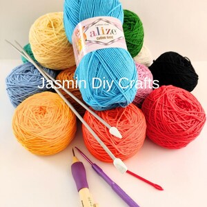 May include: A collection of colorful yarn balls in shades of blue, yellow, orange, red, green, pink, and black. Knitting needles and punch needles are also visible. The text "Jasmin Diy Crafts" is printed on the image.