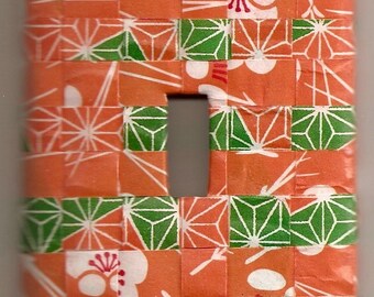 Placa de interruptor con tejido de papel de origami de color naranja