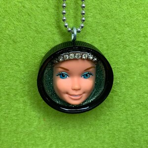 Vintage doll head pendant necklace