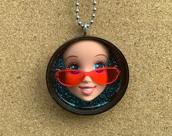 Upcycled doll face pendant necklace, Girl in red sunglassses