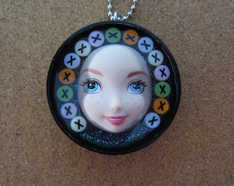 Kisses - upcycled plastic bottle cap doll face pendant