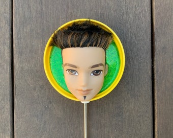 Weird Upcycled Bratz boy Doll plant stick