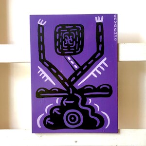 May include: Purple abstract painting with black lines and shapes. The painting features a figure with raised arms and a circular shape in the center. The artist's signature "CAVAGNAC" is in the upper right corner.