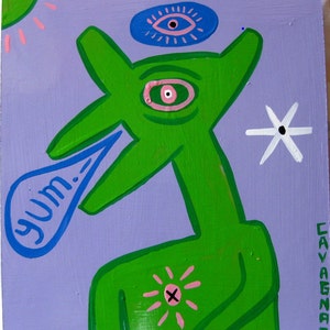 May include: A green, cartoon-like creature with a large eye and a mouth that says "yum." The creature is on a purple background with a white flower, a blue eye, and a pink sun.