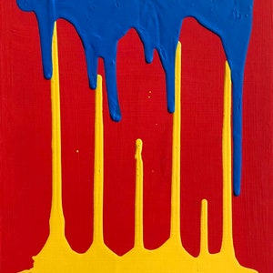 Pode incluir: Pintura abstrata com pingos de tinta azul e amarela sobre um fundo vermelho. A assinatura do artista, "EAVAGNAC", é visível no canto inferior esquerdo.