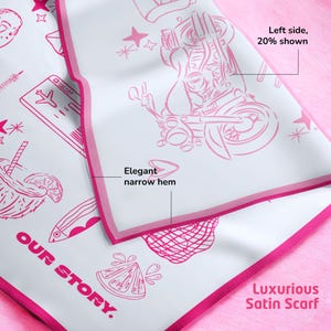 Close-up of satin scarf showing narrow hem and high-quality print details.